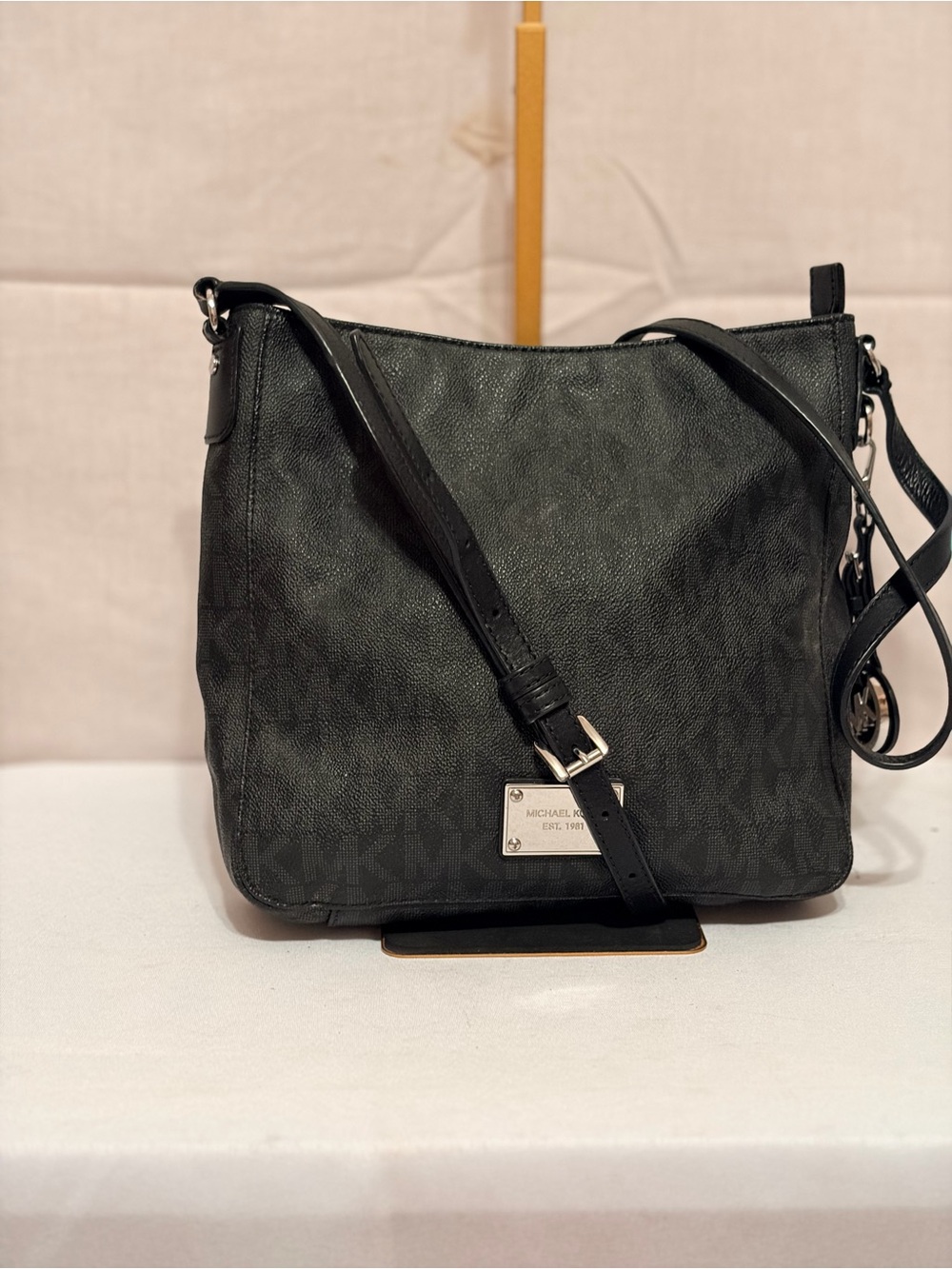 Michael Kors Jet Set Travel Large Logo Messenger Bag in black.